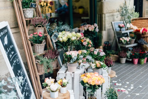 FlowerApp local florist shopfront filled with fresh flower arrangements and baskets